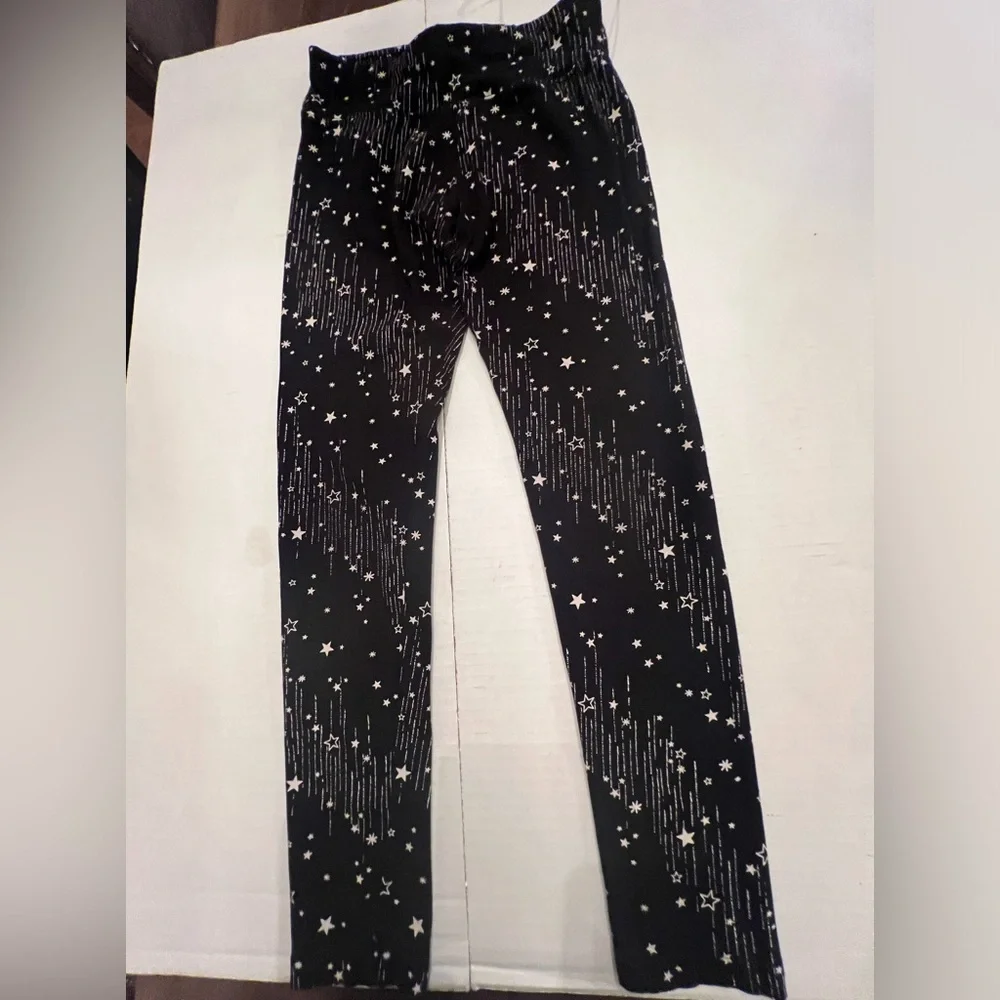 JUSTICE GIRLS LEGGINGS. SIZE 14/16  BLACK WITH STARS AND LINES